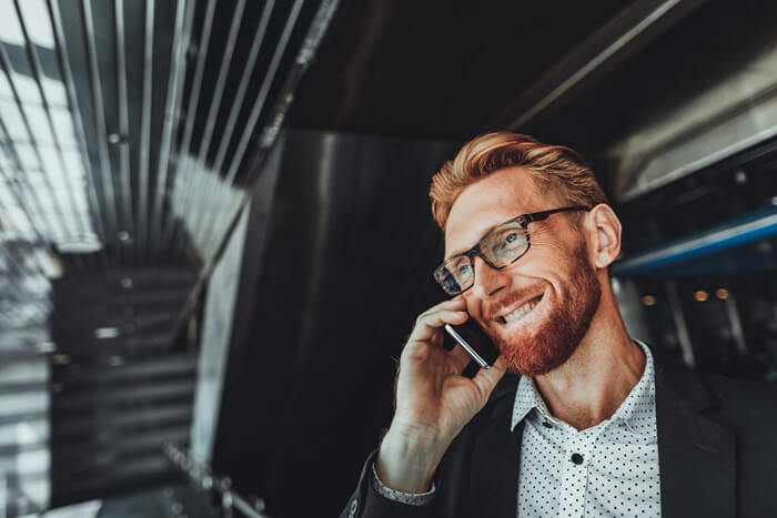 Man on the phone. With Zylinc, your call center agents and receptionists can handle inquiries via phone, chat, e-mail, and social media in a single multi-channel solution.